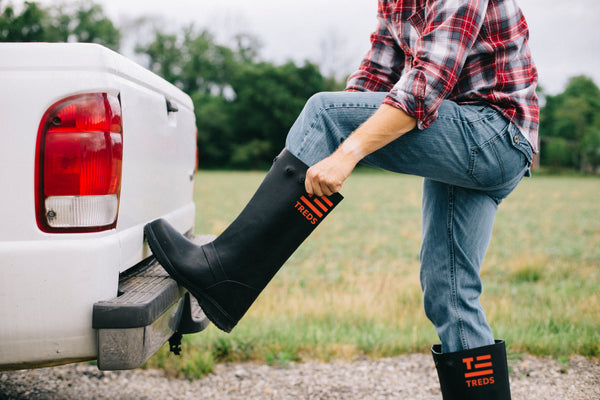 Pulling on TREDS rubber overboot that goes over shoes